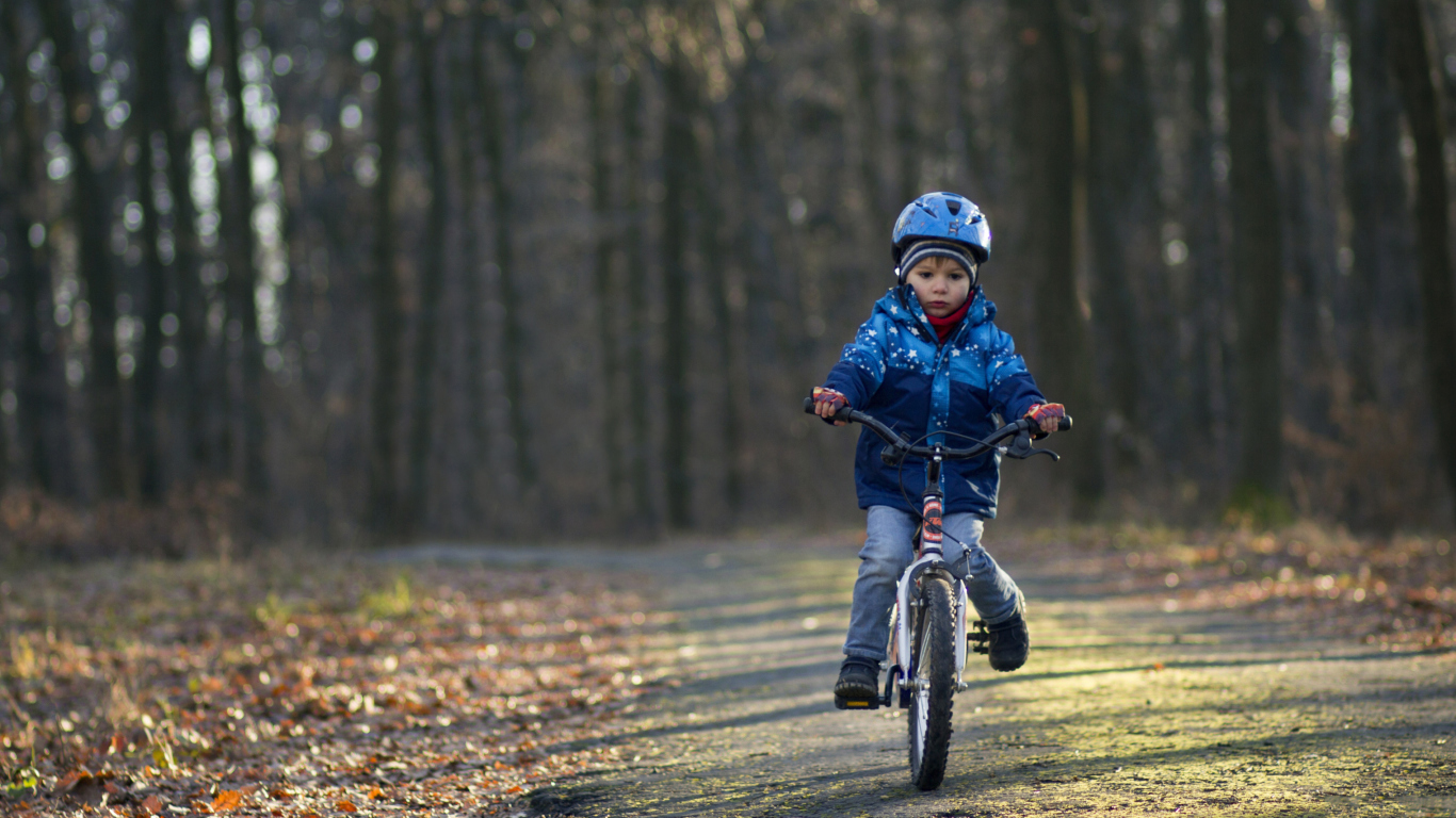 Little Boy Riding Bicycle wallpaper 1366x768