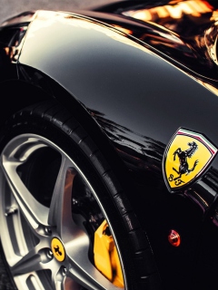 Fondo de pantalla Black Ferrari With Yellow Emblem 240x320