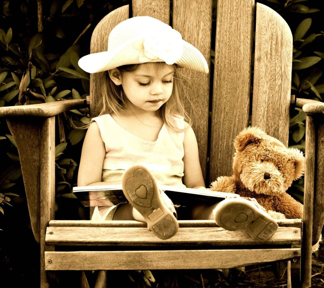 Обои Little Girl Reading Book 1080x960