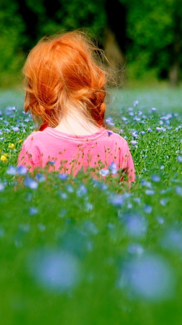 Sfondi Redhead Child Girl Behind Green Grass 360x640