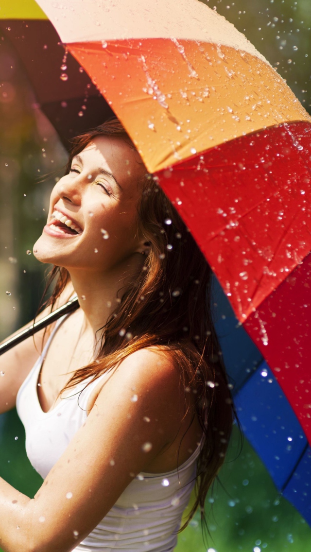 Sfondi Happy Girl With Rainbow Umbrella Under Summer Rain 640x1136
