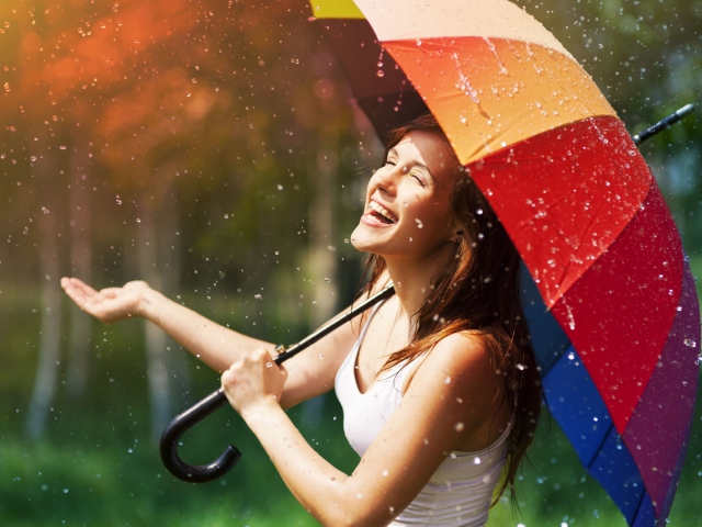 Sfondi Happy Girl With Rainbow Umbrella Under Summer Rain 640x480