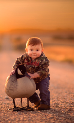 Funny Child With Duck wallpaper 240x400