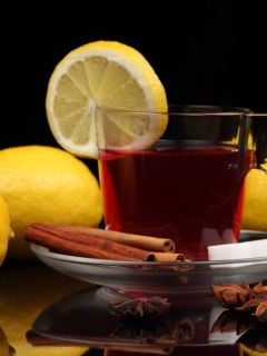 Tea with lemon and cinnamon wallpaper 240x320