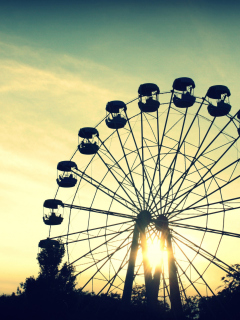 Обои Sunlight Through Ferris Wheel 240x320