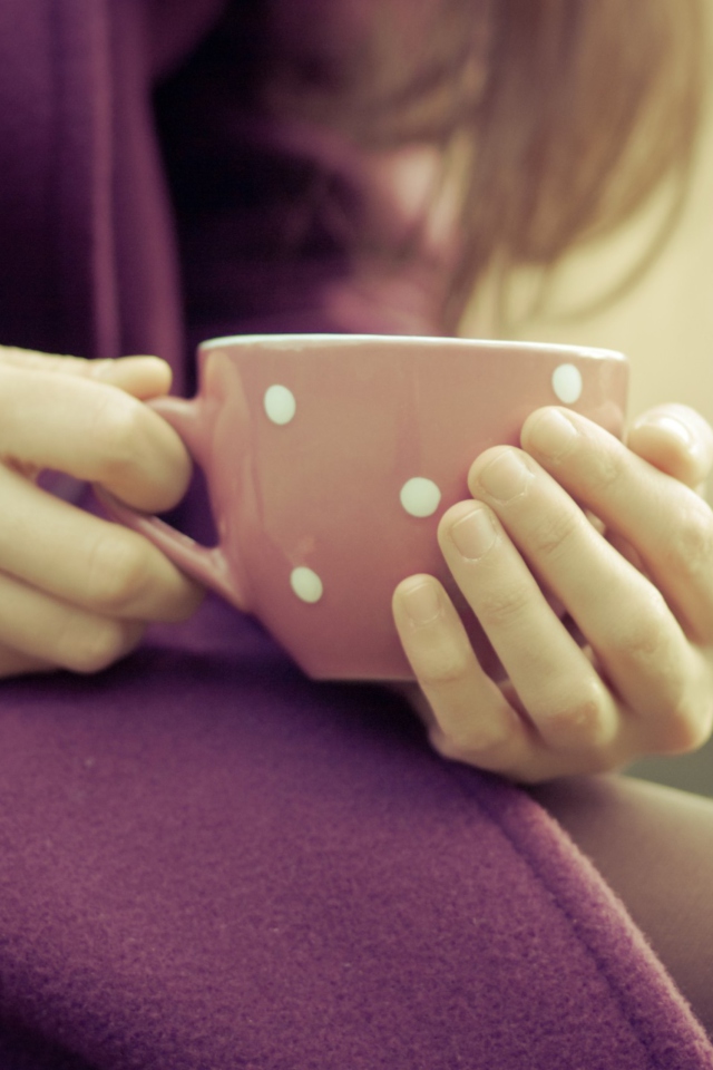 Cup Of Hot Tea In Her Hands wallpaper 640x960