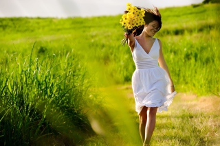 Girl With Yellow Flowers In Field Wallpaper for Android, iPhone and iPad