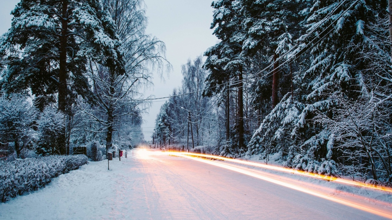 Snowy forest road wallpaper 1366x768