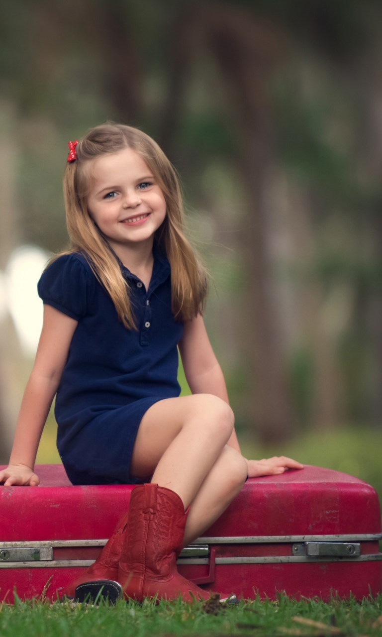 Little Girl Sitting On Red Suitcase wallpaper 768x1280