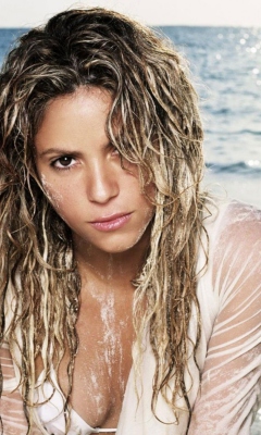 Обои Shakira On Beach 240x400