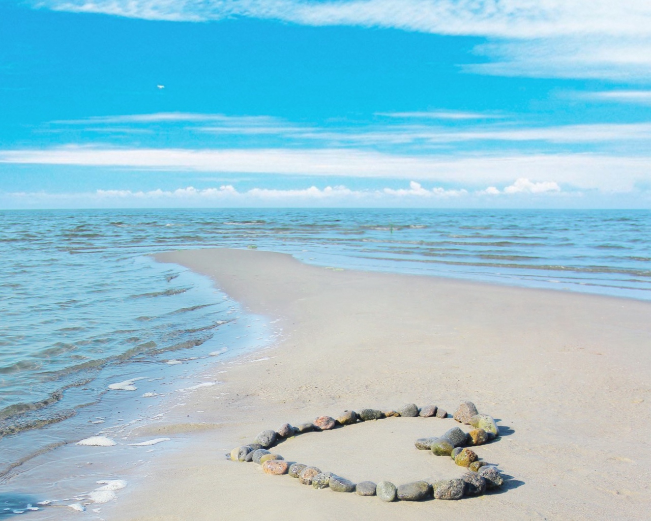 Heart Of Pebbles On Beach wallpaper 1280x1024