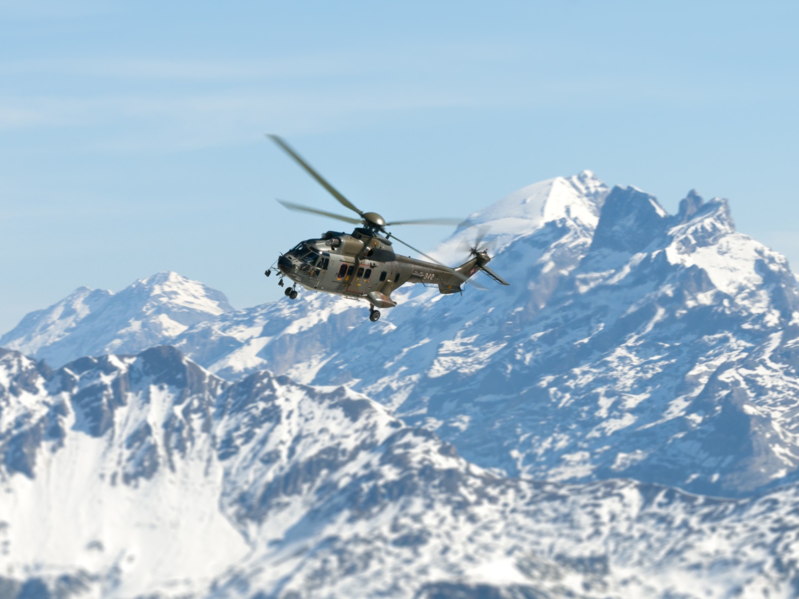Helicopter Over Snowy Mountains wallpaper 1600x1200