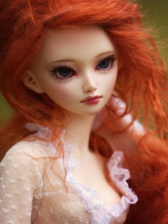 Gorgeous Redhead Doll With Sad Eyes wallpaper 240x320