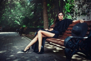 Brunette model posing on bench Picture for Android, iPhone and iPad