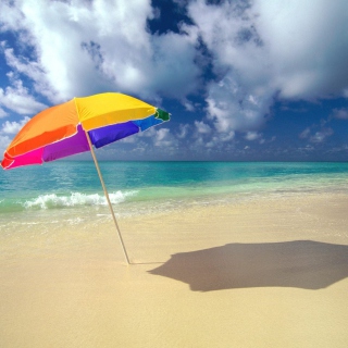 Kostenloses Rainbow Umbrella At Beach Wallpaper für iPad mini