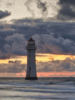 Fondo de pantalla Massive Clouds Above Lighthouse 240x320