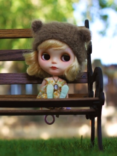 Doll Sitting On Bench wallpaper 240x320