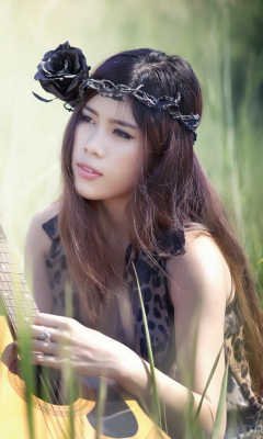 Fondo de pantalla Pretty Girl In Grass Playing Guitar 240x400
