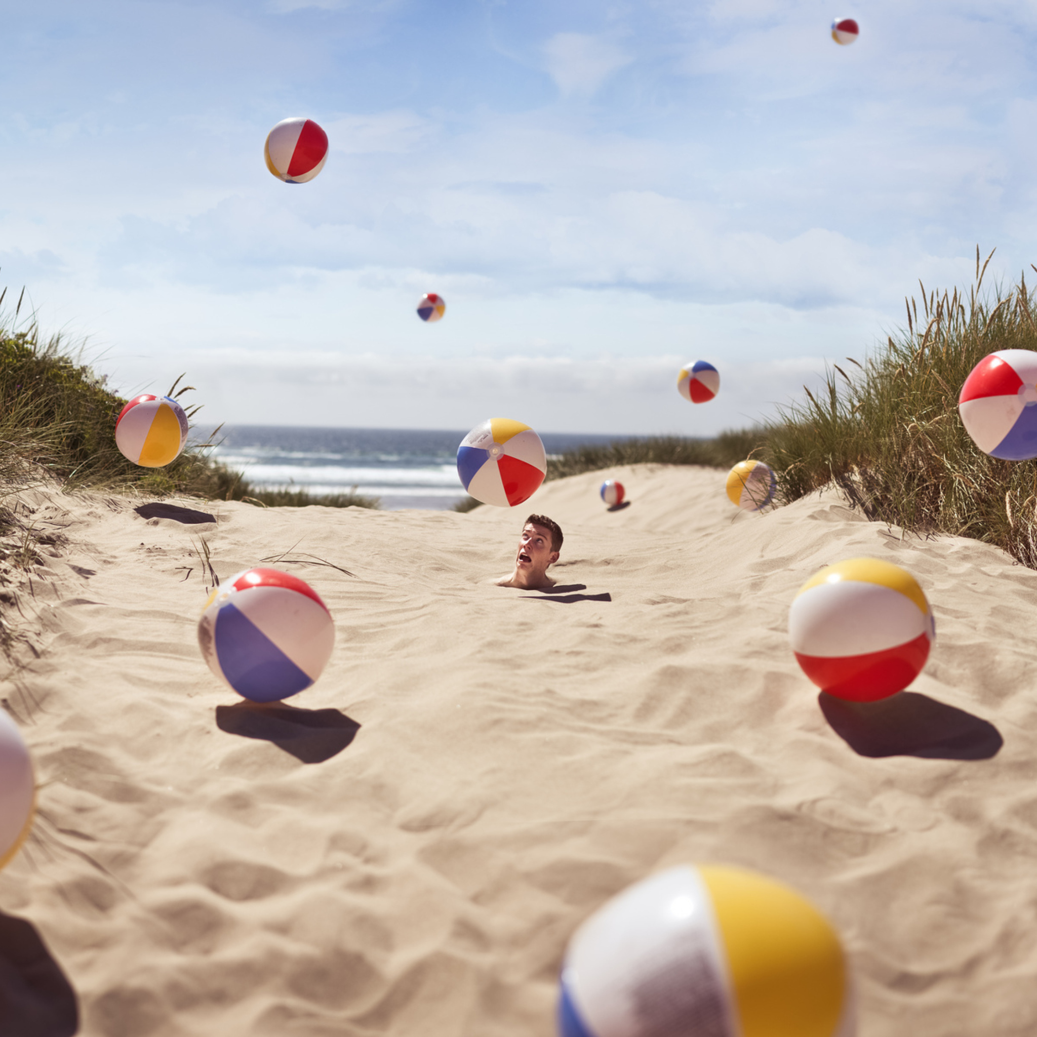 Screenshot №1 pro téma Beach Balls And Man's Head In Sand 2048x2048