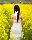 Screenshot №1 pro téma Girl At Yellow Flower Field 128x160