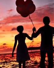 Fondo de pantalla Couple With Balloons Silhouette At Sunset 176x220