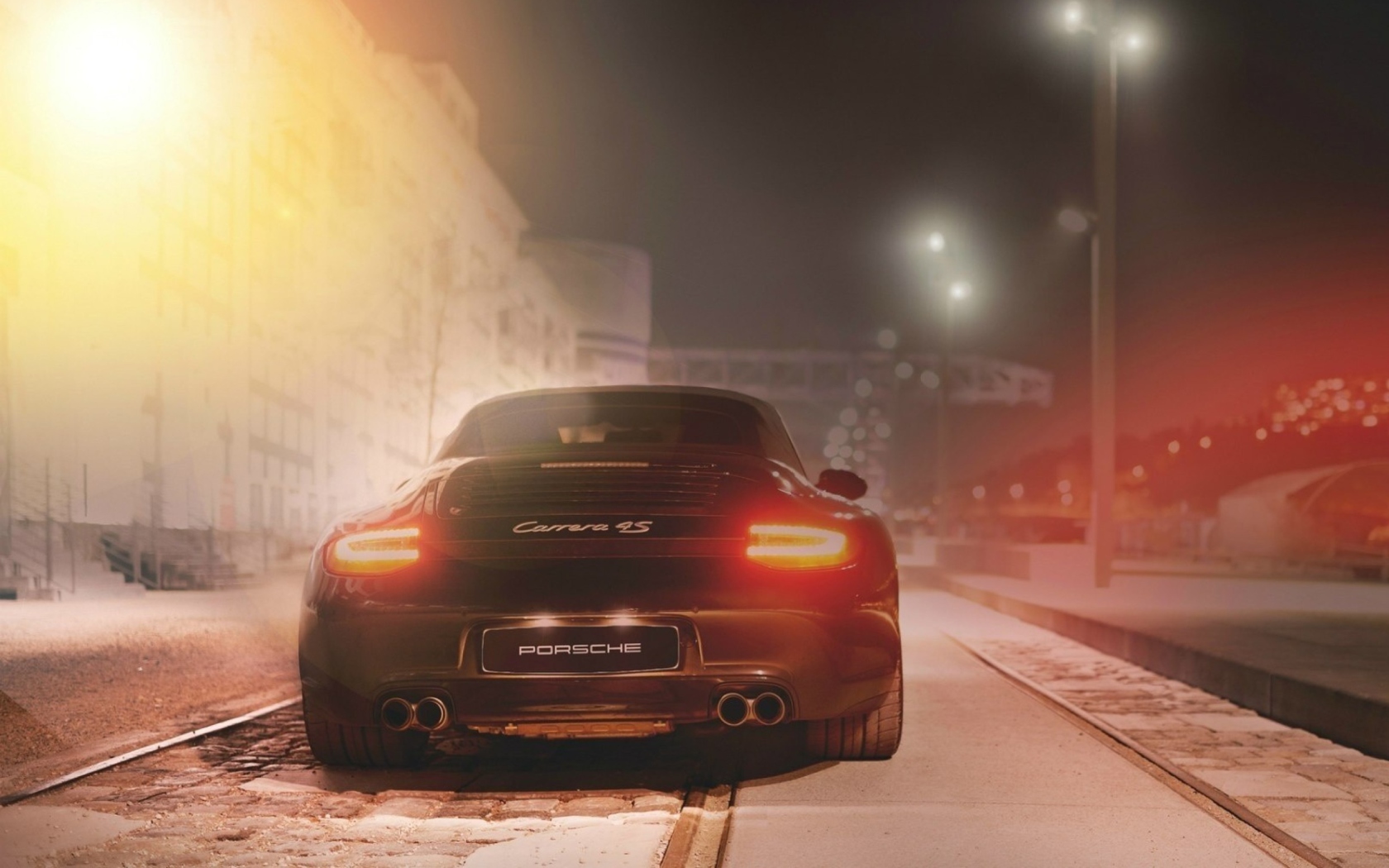 Fondo de pantalla Black Porsche Carrera At Night 1680x1050