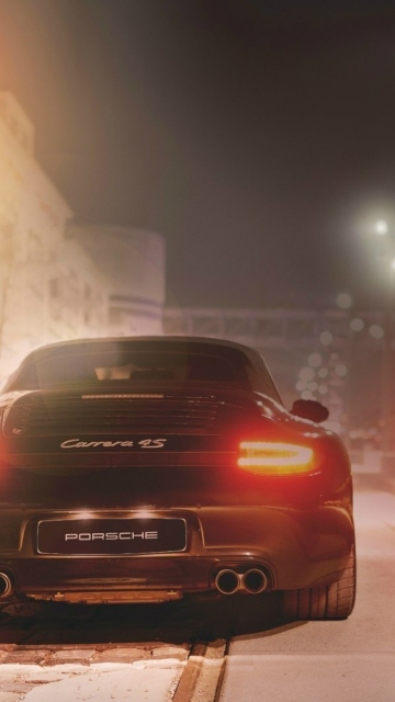 Das Black Porsche Carrera At Night Wallpaper 360x640