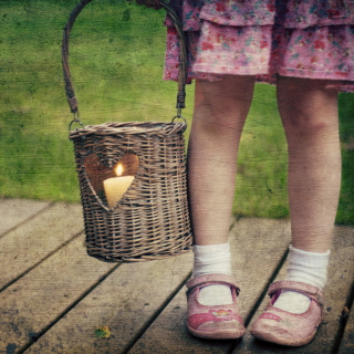 Kostenloses Child With Basket And Candle Wallpaper für iPad mini