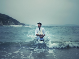 Man With Ship In Hands And Ocean Waves Around Him screenshot #1 320x240