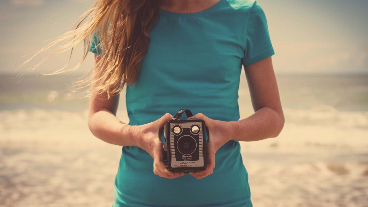 Girl On Beach With Retro Camera In Hands screenshot #1 1280x720