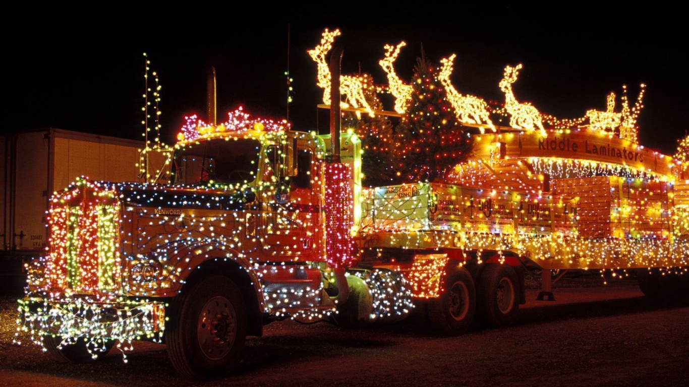 Sfondi Xmas Truck in Lights 1366x768