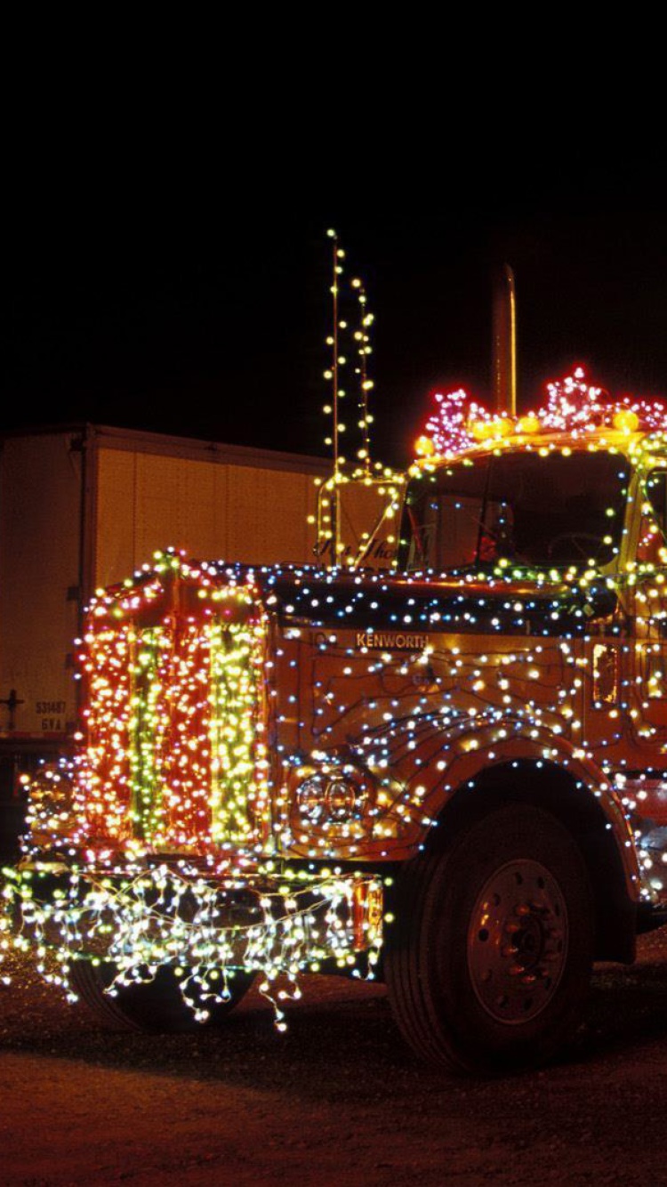 Обои Xmas Truck in Lights 750x1334