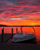 Sfondi Lake sunrise with boat 128x160