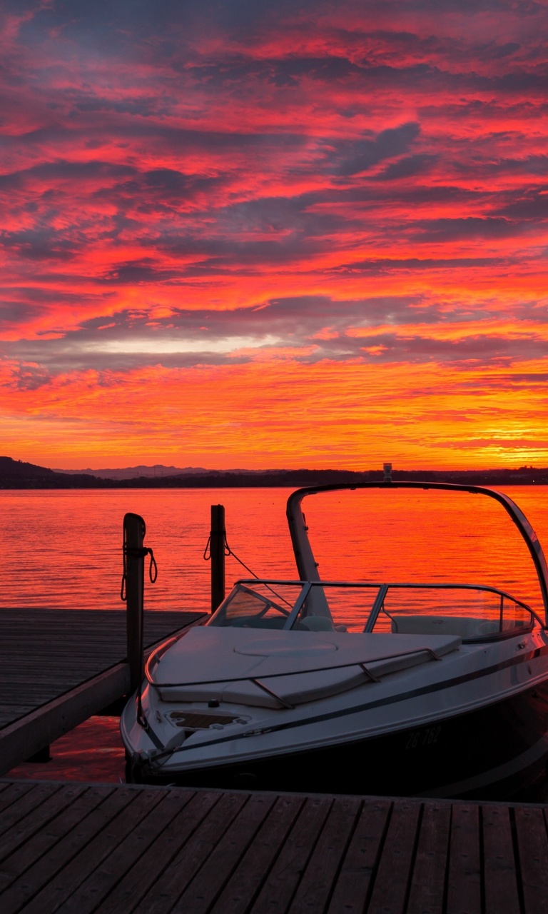 Обои Lake sunrise with boat 768x1280