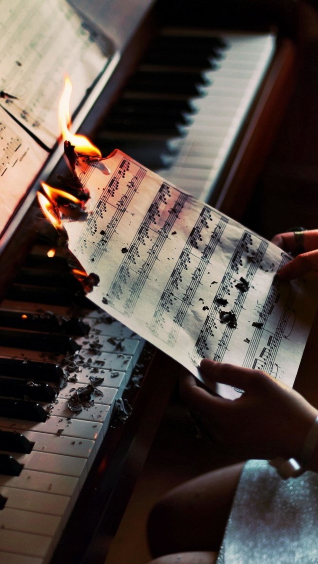 Sheet Music in Fire wallpaper 640x1136