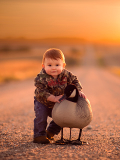 Kid and Duck wallpaper 240x320