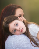 Mom And Daughter With Blue Eyes wallpaper 128x160
