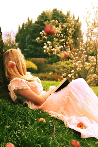 Fondo de pantalla Blonde Girl Reading Book Under Tree 320x480