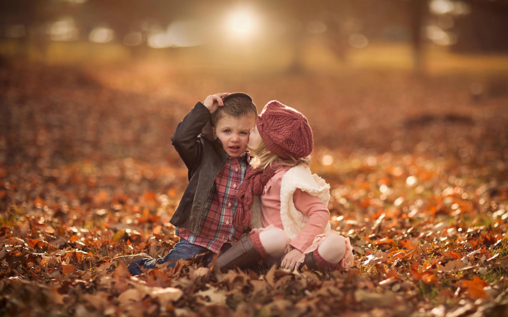 Boy and Girl in Autumn Garden wallpaper 1680x1050