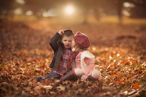 Boy and Girl in Autumn Garden wallpaper 480x320