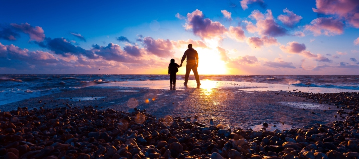 Father And Son On Beach At Sunset wallpaper 720x320