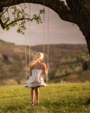 Sfondi Girl On Tree Swing 128x160