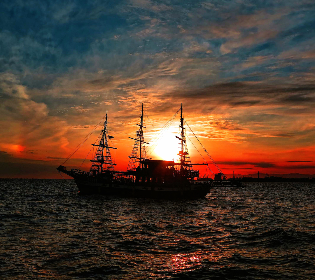 Ship in sunset wallpaper 1080x960