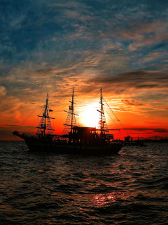 Ship in sunset wallpaper 240x320