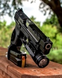 Обои Smith and Wesson 9mm 128x160