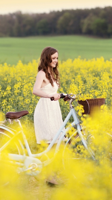 Fondo de pantalla Girl With Bicycle In Yellow Field 360x640