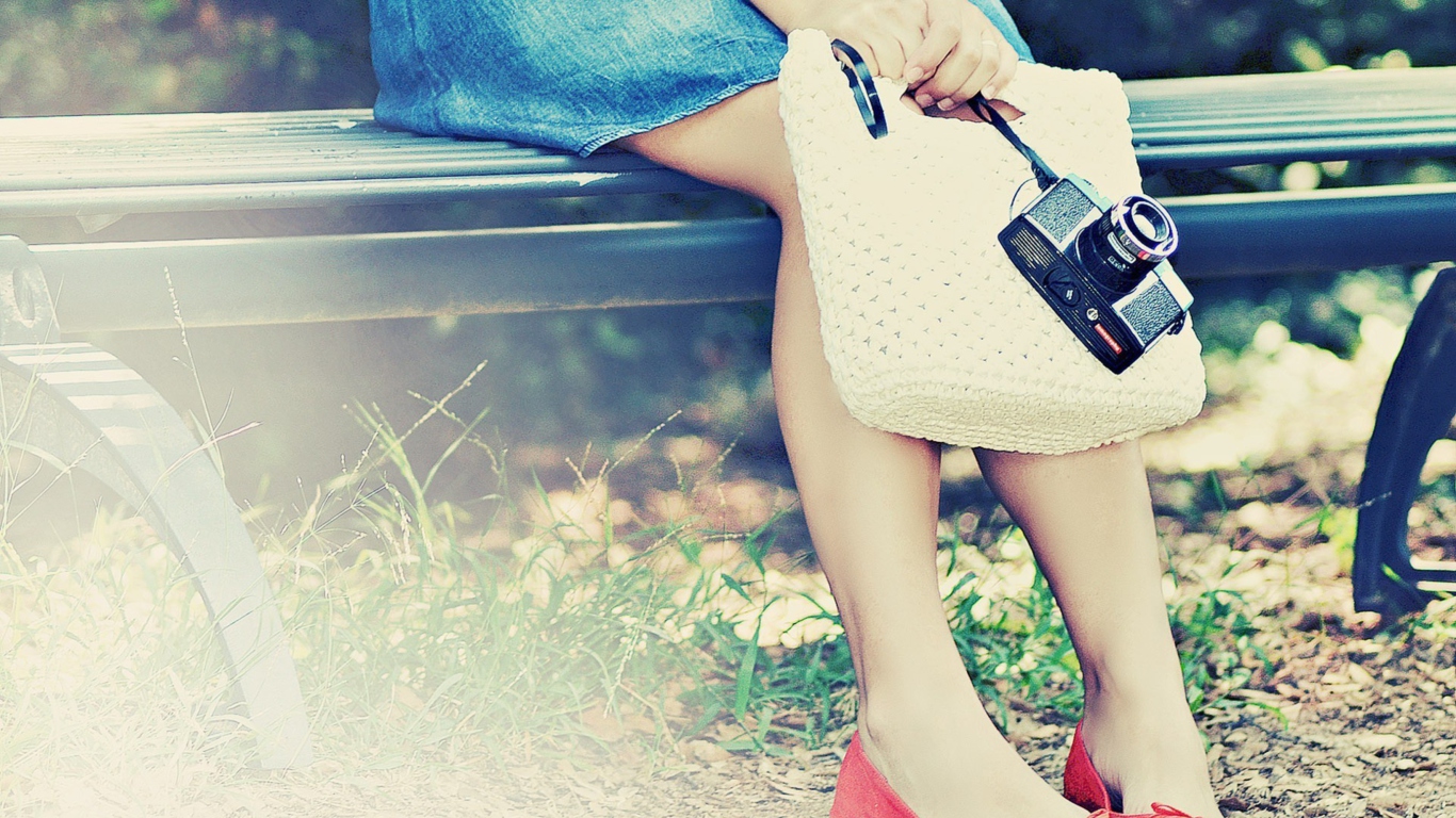 Girl With Camera Sitting On Bench screenshot #1 1366x768