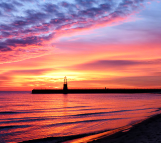 Kostenloses Lighthouse And Red Sunset Beach Wallpaper für iPad