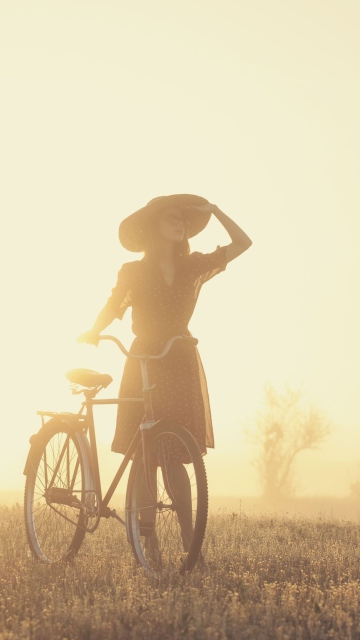 Fondo de pantalla Girl And Bicycle On Misty Day 360x640