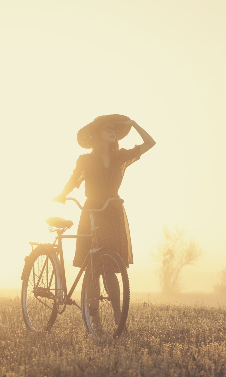 Sfondi Girl And Bicycle On Misty Day 768x1280